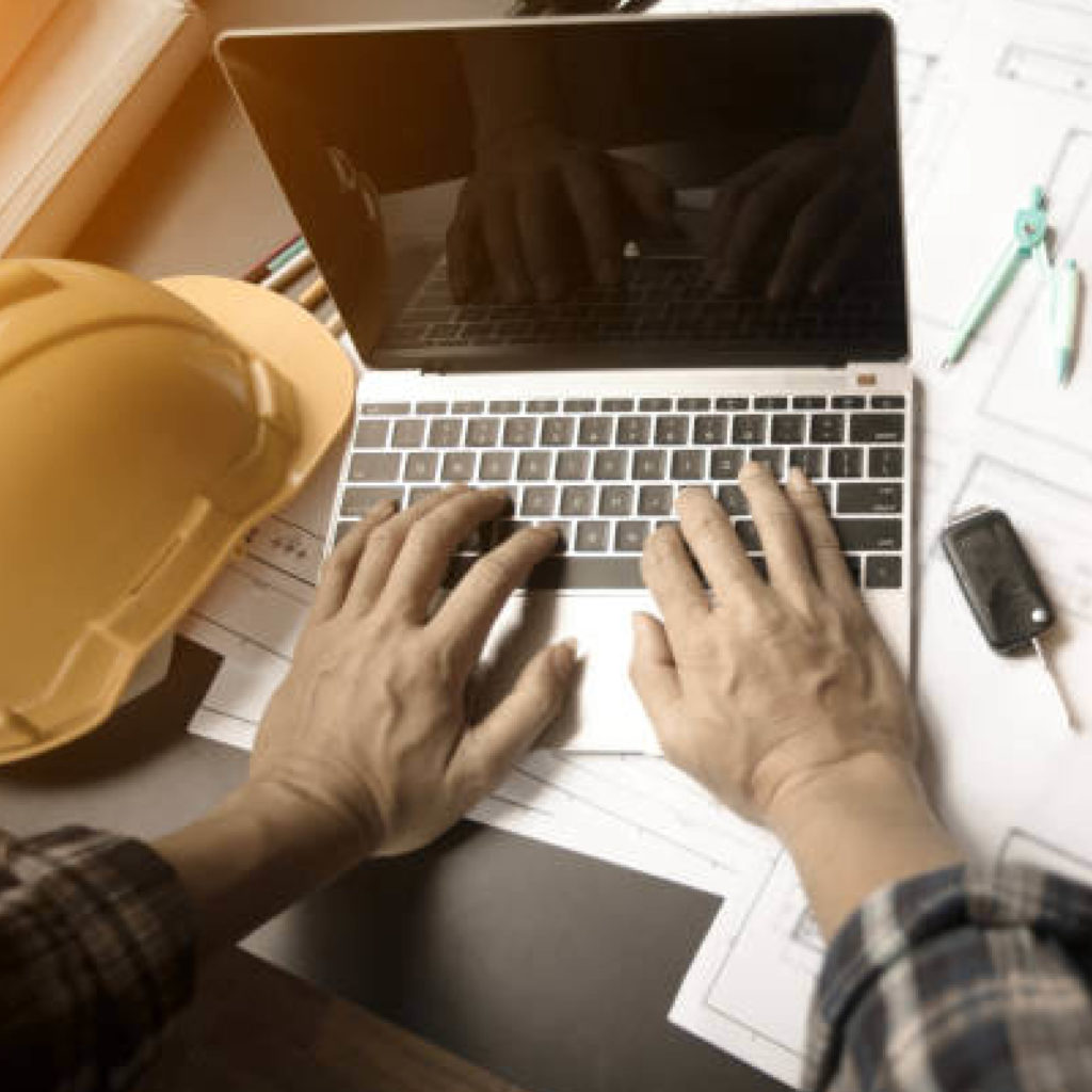 Construction laptop typing