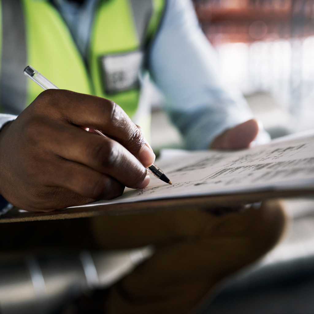 Construction worker writing OSHA