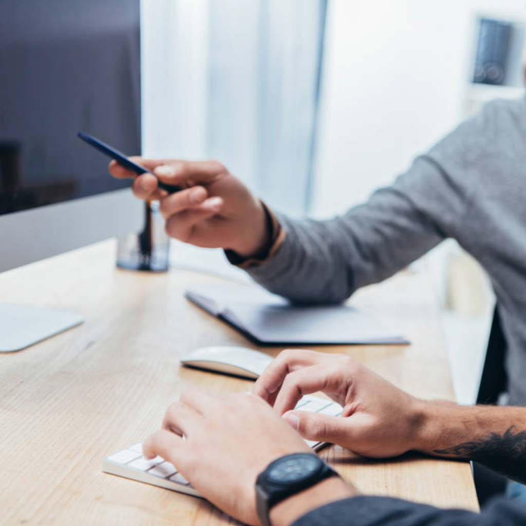 Person pointing on computer screen