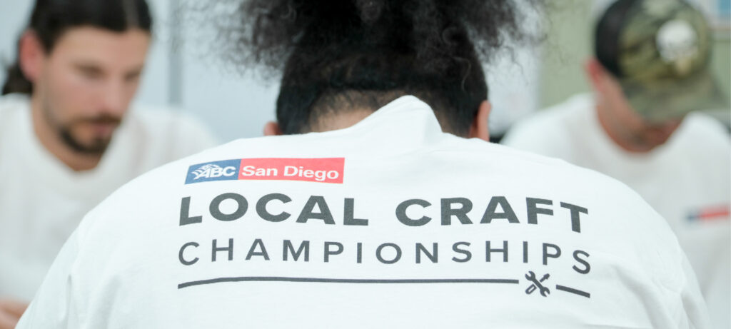Person wearing a Local Craft Championships t-shirt, viewed from behind