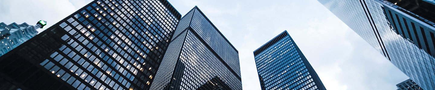 Low-angle view of modern glass high-rise office towers