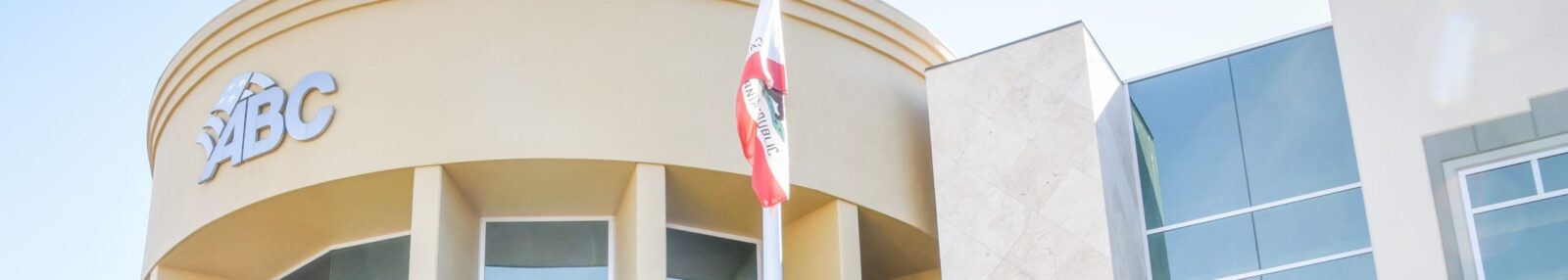 Exterior of the ABC building with a California state flag