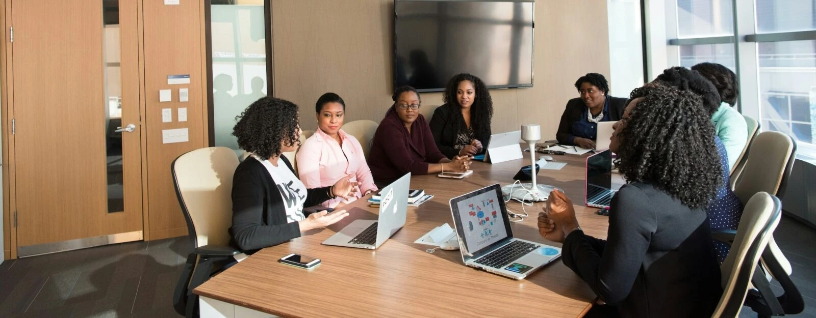 Group of people meeting around a conference table