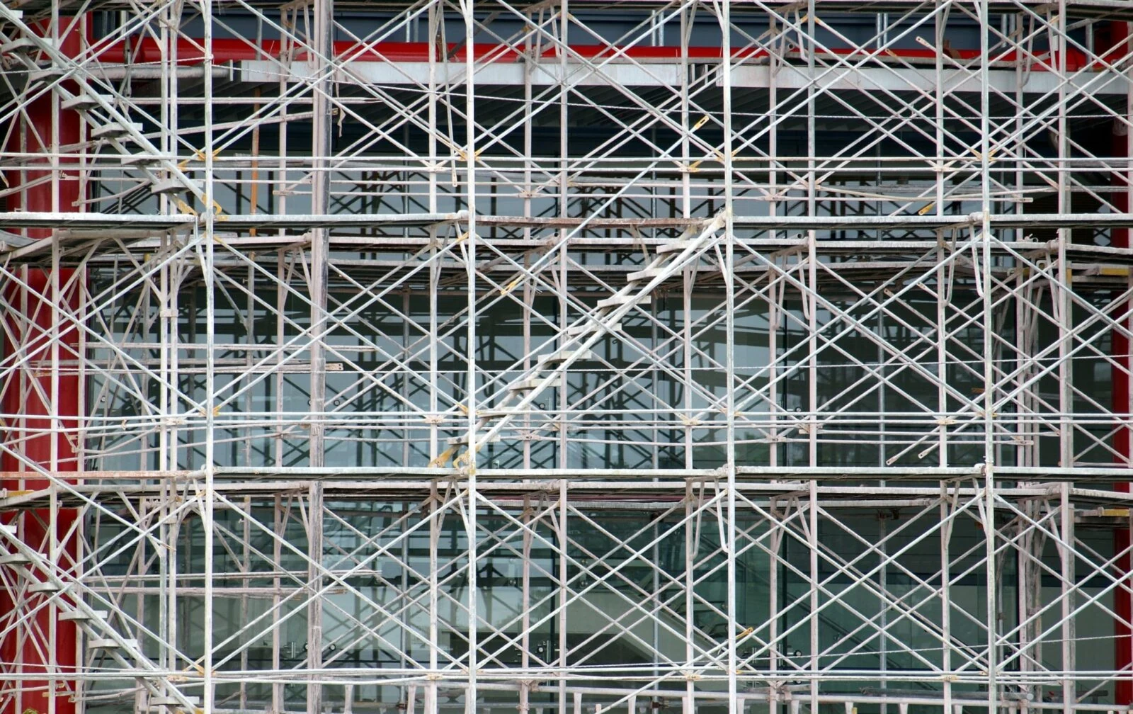 Dense metal scaffolding covering a building facade