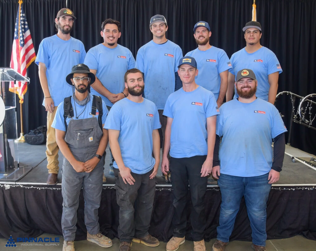 Group of young men in blue shirts at the Local Craft Championship event.
