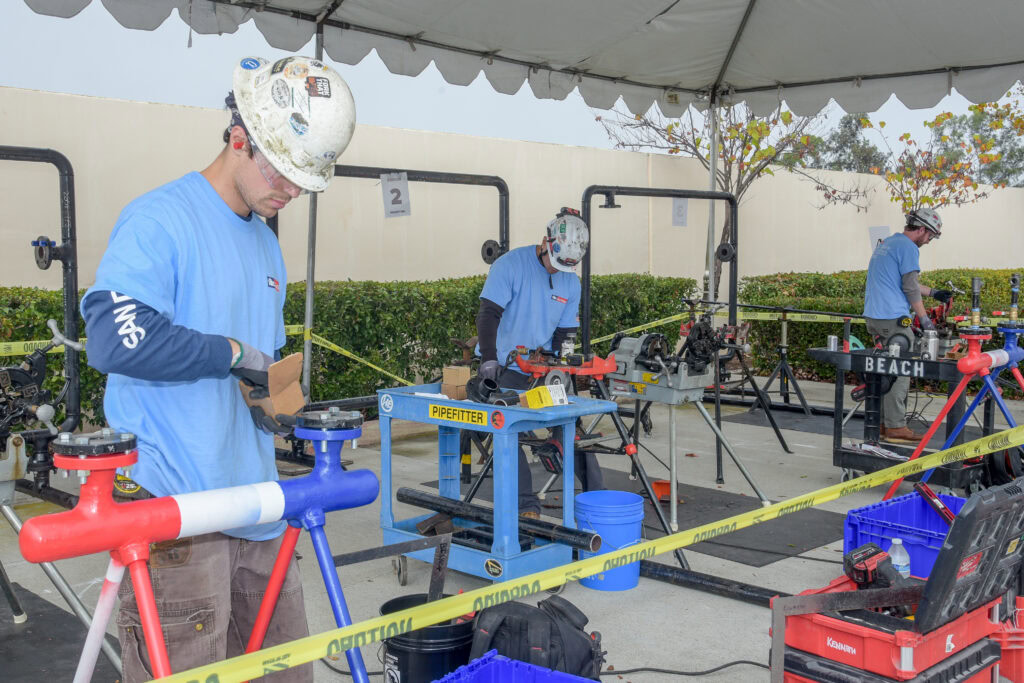 Young builders working on craft projects at the Associated Builders and Contractors event.